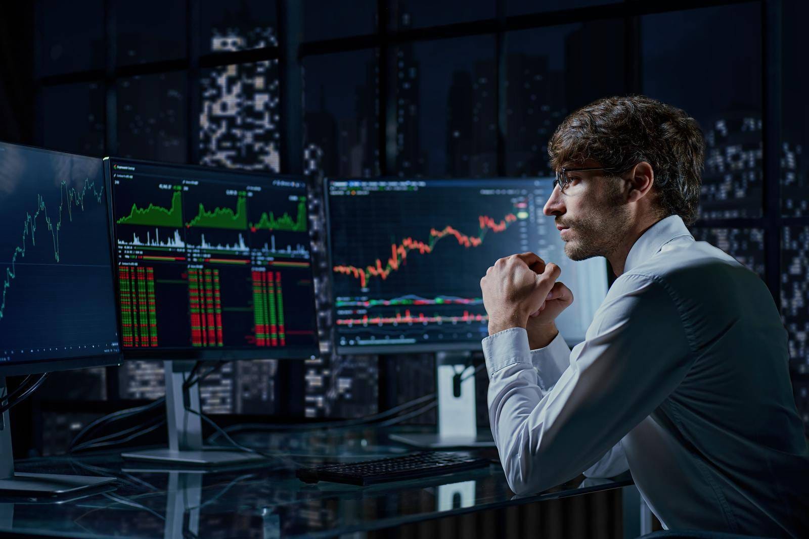 Business Man Looking At The Charts Of The Stock Market Of Cryptocurrencies On The PC Screen