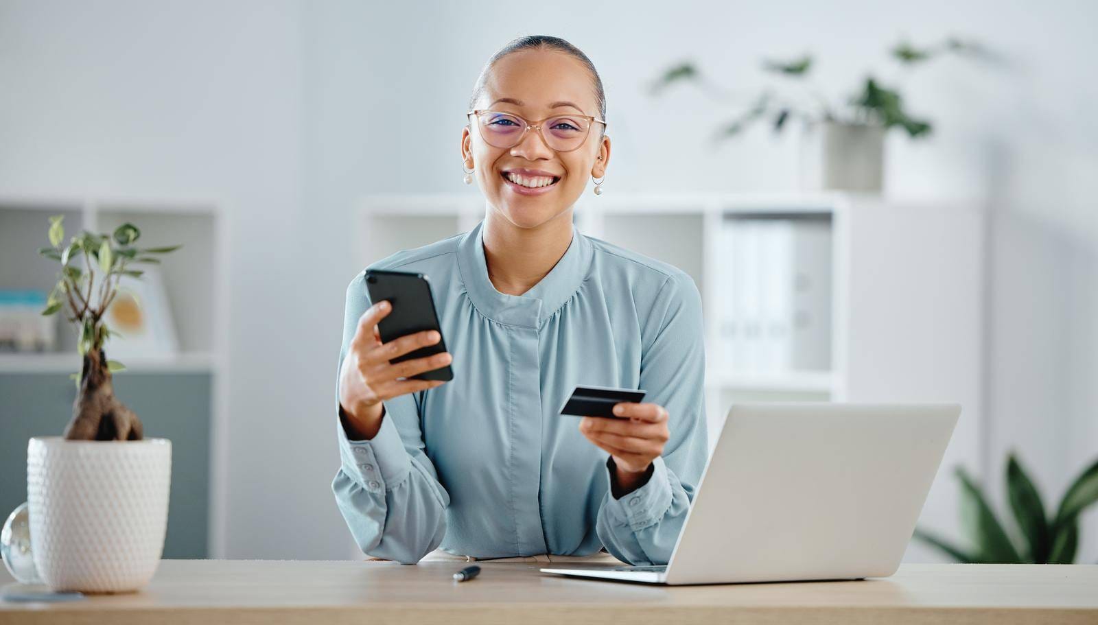 Businesswoman, Finance Advisor And Executive Shopping Online With A Phone And Credit Card In An Office