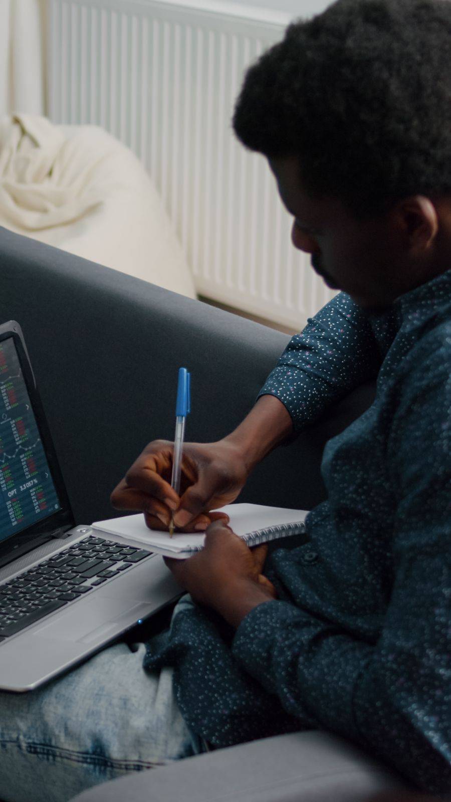 African American Man Analyzing Crypto Currency Stock Markets Trading Checking Stock Ticker Index