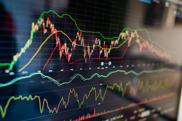 Selective focus on a stock market graph, underscoring the concept of the Inverse Head and Shoulders chart pattern.