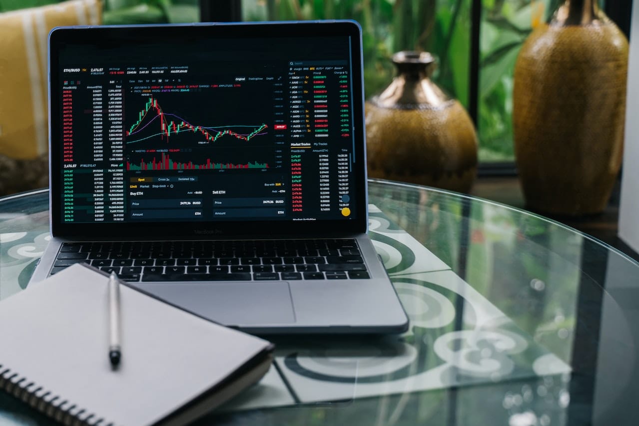 cryptocurrency market chart pattern displayed on a laptop