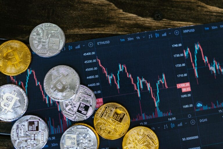 Candle stick graph of crypto users with gold and silver coins symbolizing values; trading money evolution